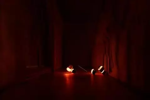 AI Video from prompt: The lamps in the corridor unscrew themselves and