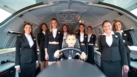 AI Video from prompt: Cinematic aerial view, a thrilled child captaini