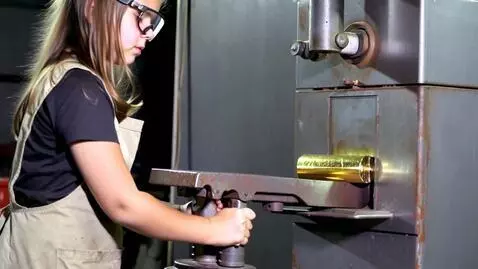 AI Video from prompt: Girl crushing gold bar