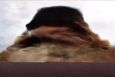 AI Video from prompt: A cowboy in a hat spins the cylinder of a revolv