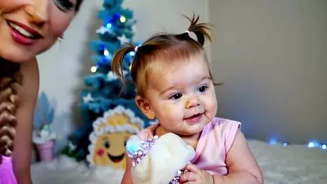 AI Video from prompt: A cheerful baby girl with fair skin, light brown