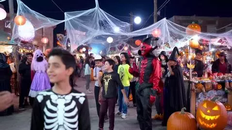 AI Video from prompt: Beautiful Halloween town people wear Halloween c