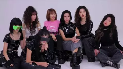AI Video from prompt: K-pop girl group with 20 members. 15 members are