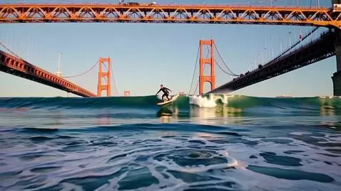 AI Video from prompt: A guy in a black wetsuit jumps on a board under 