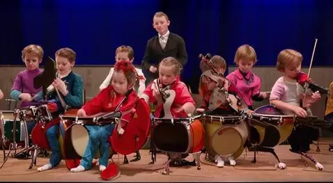 AI Video from prompt: Playing orchestra in group of children