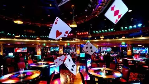 AI Video from prompt: Aces cards flying in the air around casino