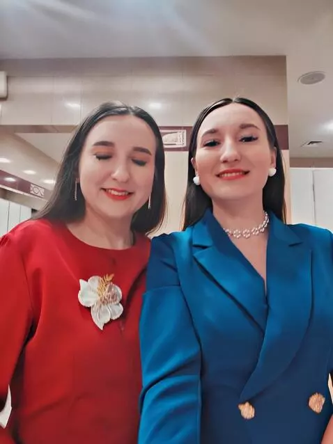 AI Video from prompt: Two woman with stockings show he's body and legs