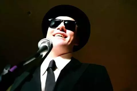 AI Video from prompt: A low angle shot of a tall white man in dark sun