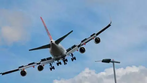 AI Video from prompt: A realistic passenger plane flies in the sky abo