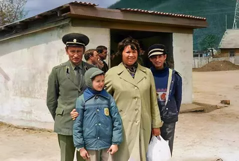 AI Video from prompt: The family is standing at the bus stop, preparin