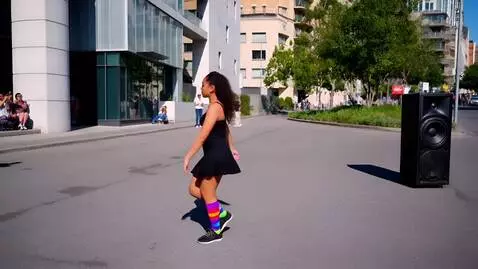 AI Video from prompt: A dancer in sports socks twirls to music from a 