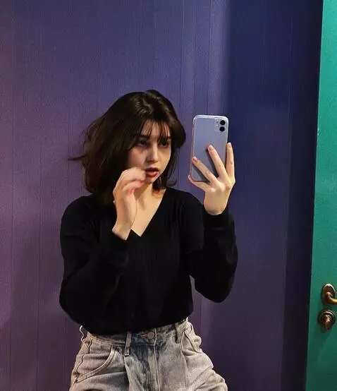 AI Video from prompt: The girl sits on her knees and beautifully shows