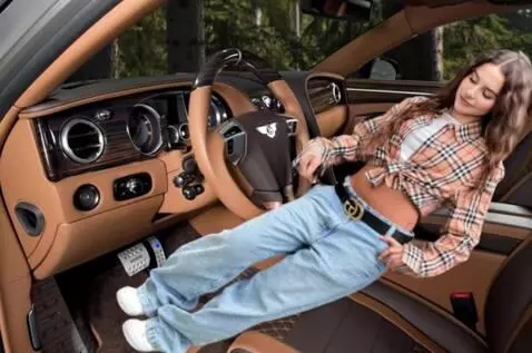 AI Video from prompt: She gets into the car and tries to start it by p