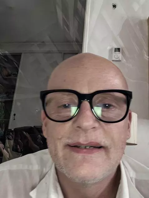 AI Video from prompt: A charismatic man standing in the center of a cr