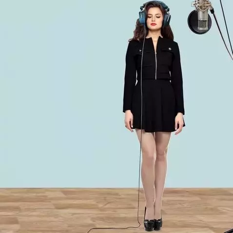 AI Video from prompt: A young woman in a recording studio. Listening t