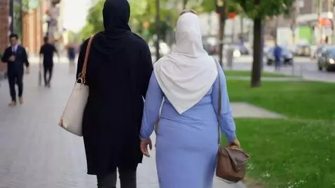 AI Video from prompt: woman, big ass, tight hijab, back view, street, 