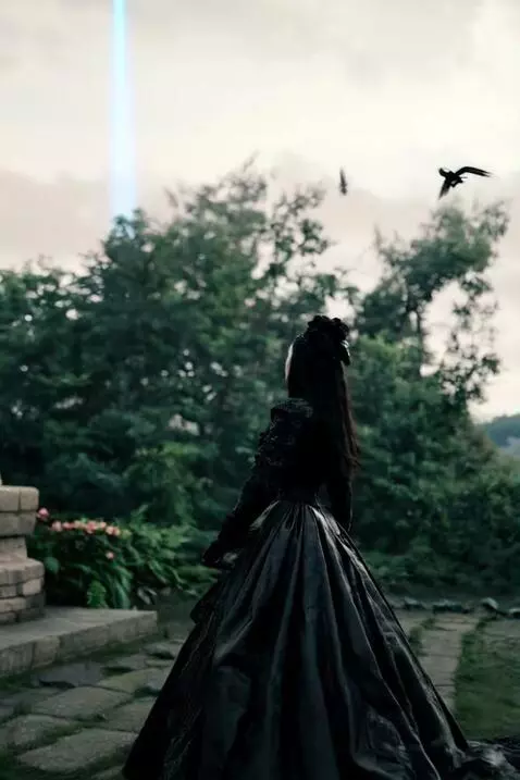 AI Video from prompt: Mysterious woman has birds flying around her she