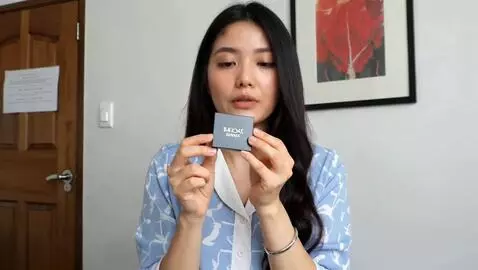AI Video from prompt: A 23 year old asian girl is demonstrating a cosm