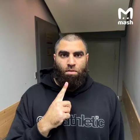 AI Video from prompt: the man raises his index finger to his mouth