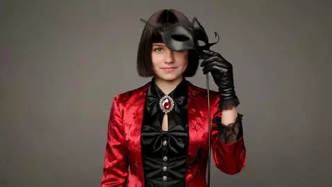 AI Video from prompt: The girl covered her face with a masquerade mask
