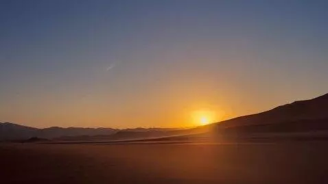 AI Video from prompt: Background: desert sunrise.