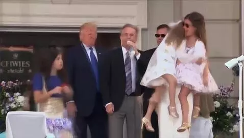AI Video from prompt: Donald Trump spraying money on a lady