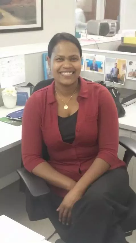 AI Video from prompt: Stands up and turns around to pick up bag.