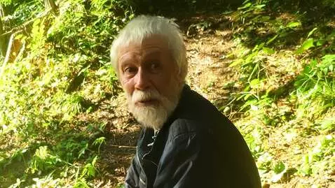 AI Video from prompt: A frightened bearded old man is shocked to see i