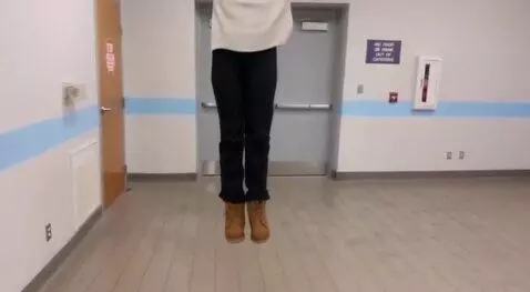 AI Video from prompt: teenage girl flying up and out of frame with the