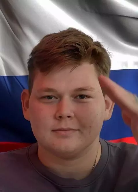 AI Video from prompt: A young man in a formal military-style uniform, 