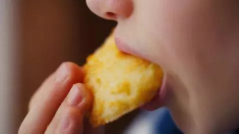 AI Video from prompt: Slow-motion close-up as the Russian girl bites i