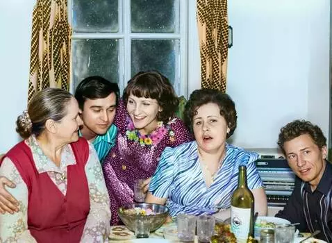 AI Video from prompt: People are sitting at the table and talking merr