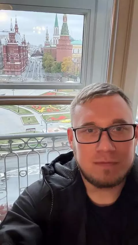 AI Video from prompt: Generate background as black. Dress the man in a