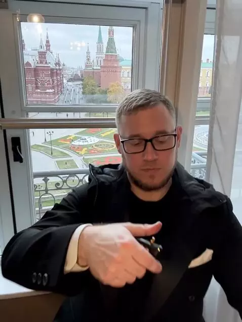 AI Video from prompt: Generate background as black. Dress the man in a