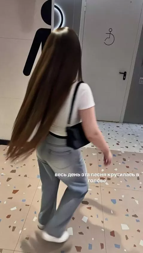 AI Video from prompt: The woman playfully twirls in front of a geometr