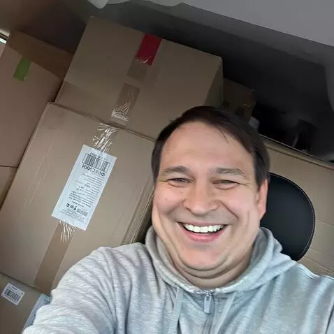 AI Video from prompt: The man on the photo is sitting in the car, the 