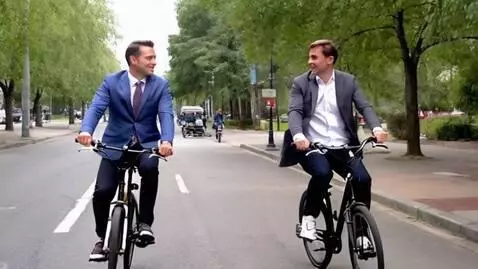 AI Video from prompt: "Vladimir Putin and Volodymyr Zelensky riding bi