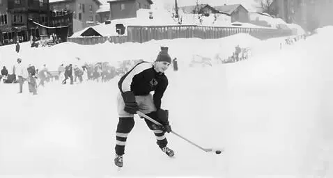 AI Video from prompt: handheld camera. 1960s. 20-years old hockey play