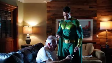 AI Video from prompt: fast zoom on man in superhero costume, green cos