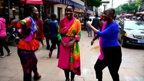 AI Video from prompt: 2 Africans approach the woman and they start dan