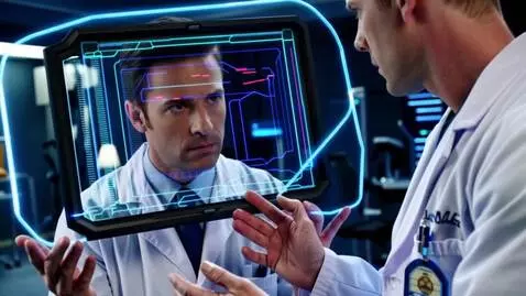 AI Video from prompt: The doctor analyzes data through a neon holograp
