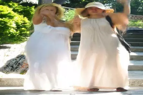 AI Video from prompt: DANCING, WAVING THEIR ARMS