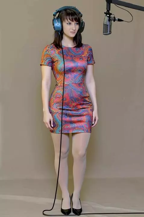 AI Video from prompt: A young woman in a recording studio. Listening t