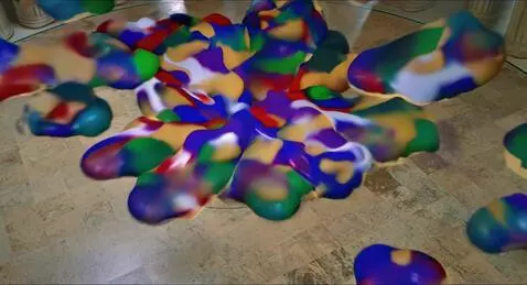 AI Video from prompt: The approaching blobs of paint converge and cove