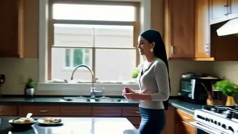 AI Video from prompt: A young Saudi woman in a modern kitchen preparin