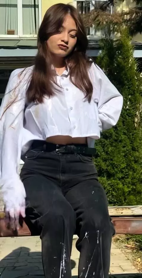 AI Video from prompt: Posing in bikini, smeared in white slime