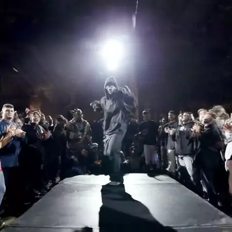 AI Video from prompt: Under a roaring crowd, he steps onto the makeshi