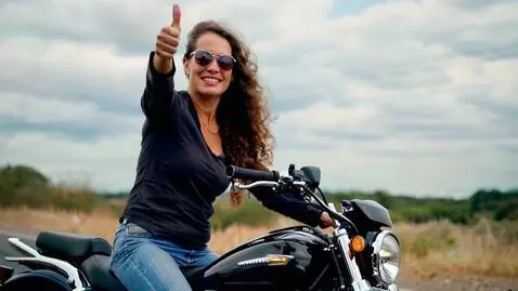 AI Video from prompt: adult version.woman driving motocyle