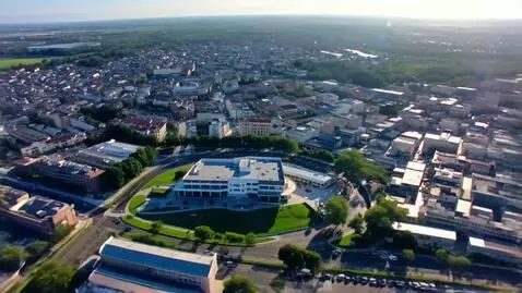 AI Video from prompt: FPV drone shot starting high above the earth, zo
