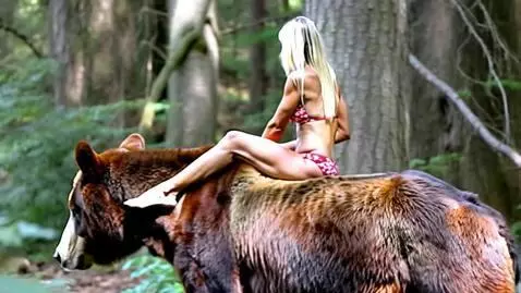 AI Video from prompt: A woman with long blonde hair, wearing a red and